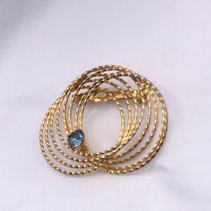 Gold-tone Circular Brooch with Blue Rhinestone